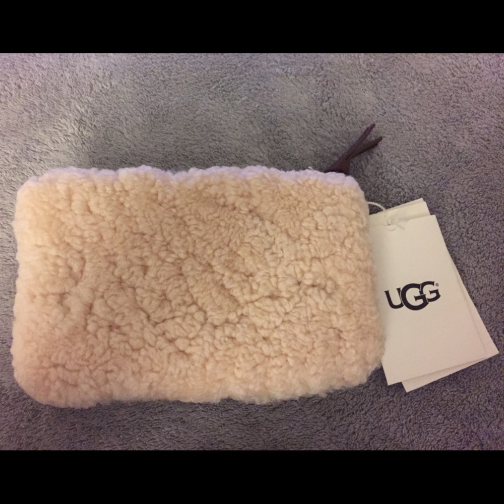 New with tags authentic Ugg wristlet.